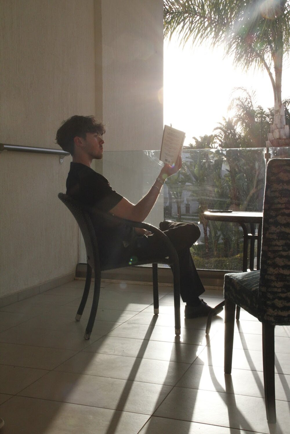 Jason reading a book in golden evening light